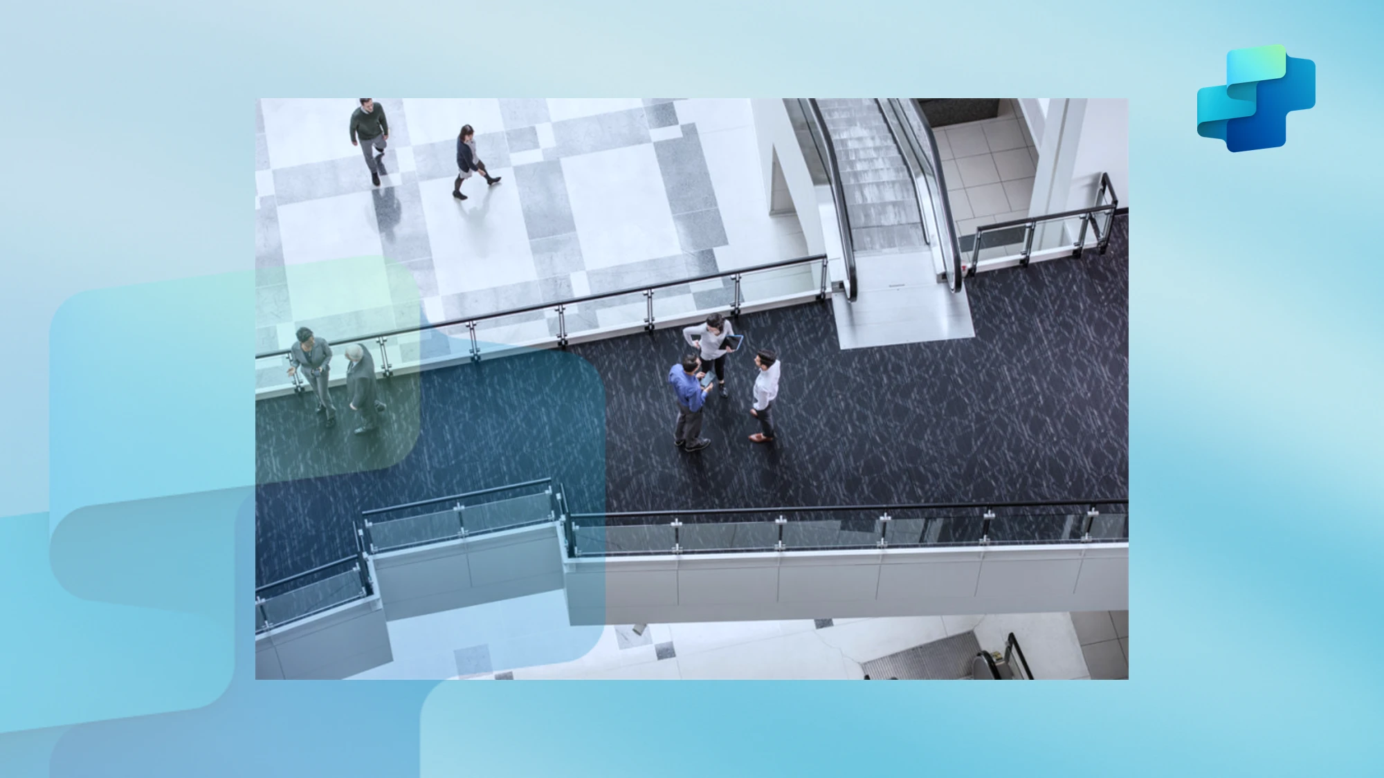 Aerial view of people working on multiple floors in an office