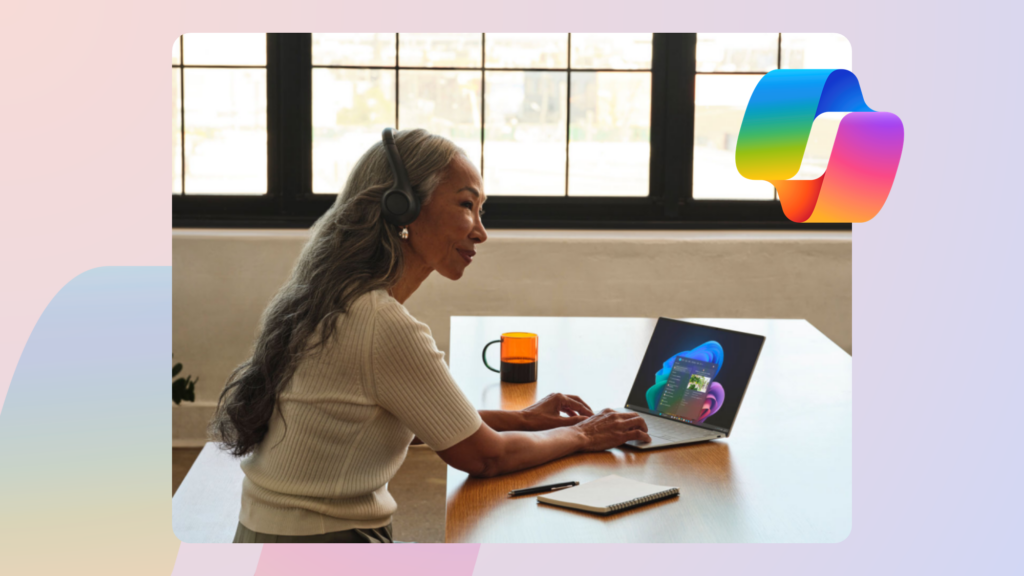 A woman sitting at a desk with a laptop