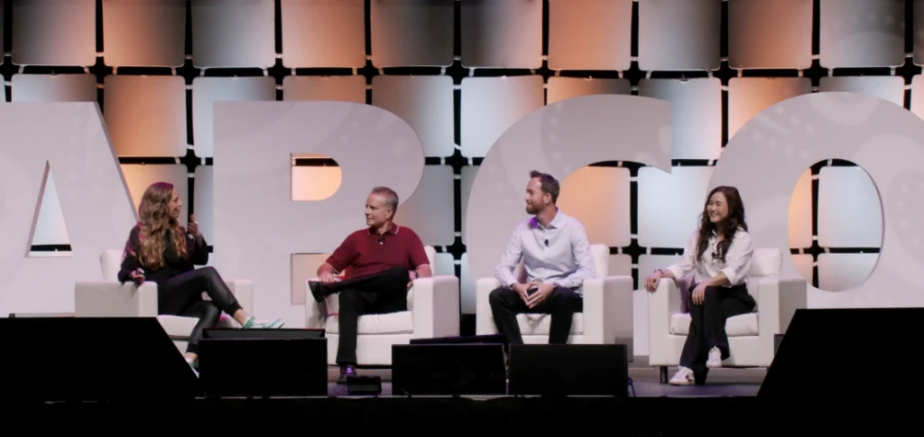 A group of people sitting on a stage