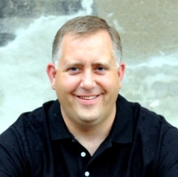 a man smiling for the camera