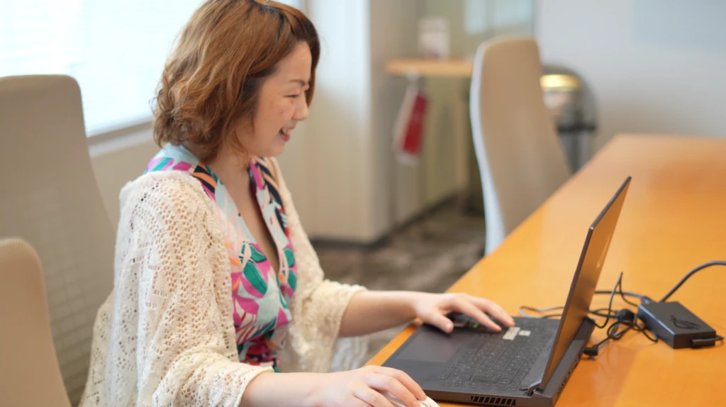 Miyu Takai is using her laptop