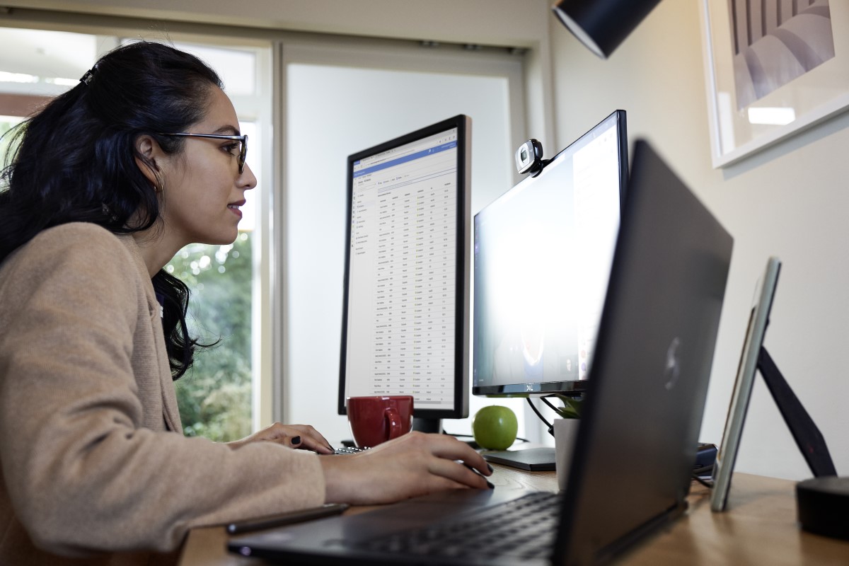 Female working from her home office on Dell Latitude 13devices