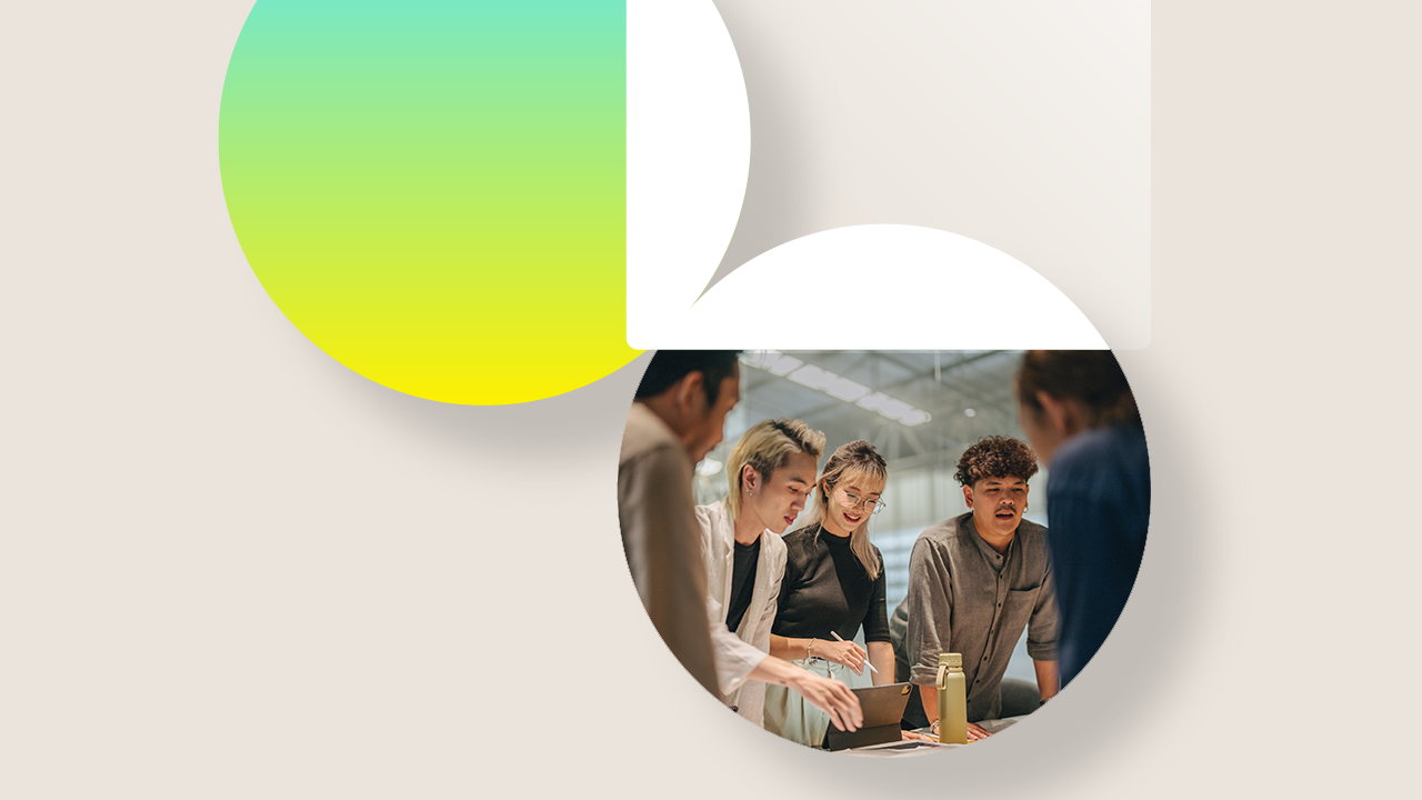 group of colleagues around a computer