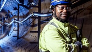 Balfour Beatty thumbnail - A man wearing a hard hat and glasses