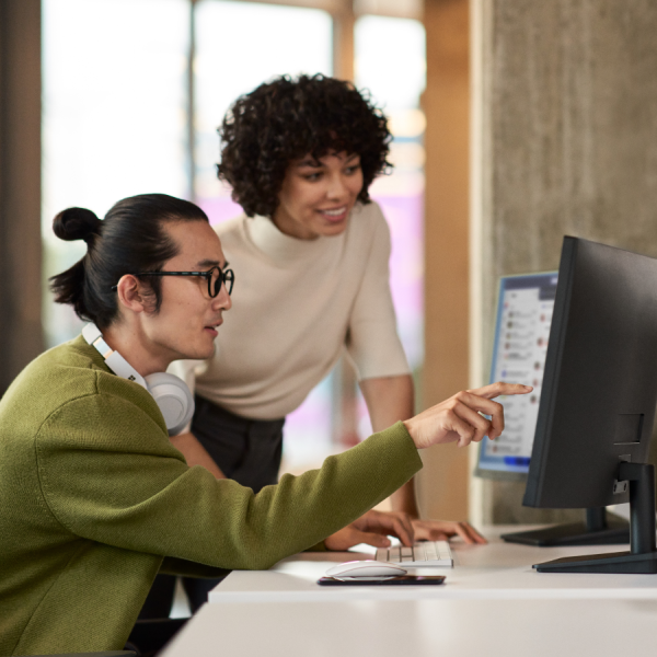 two colleagues looking at computer