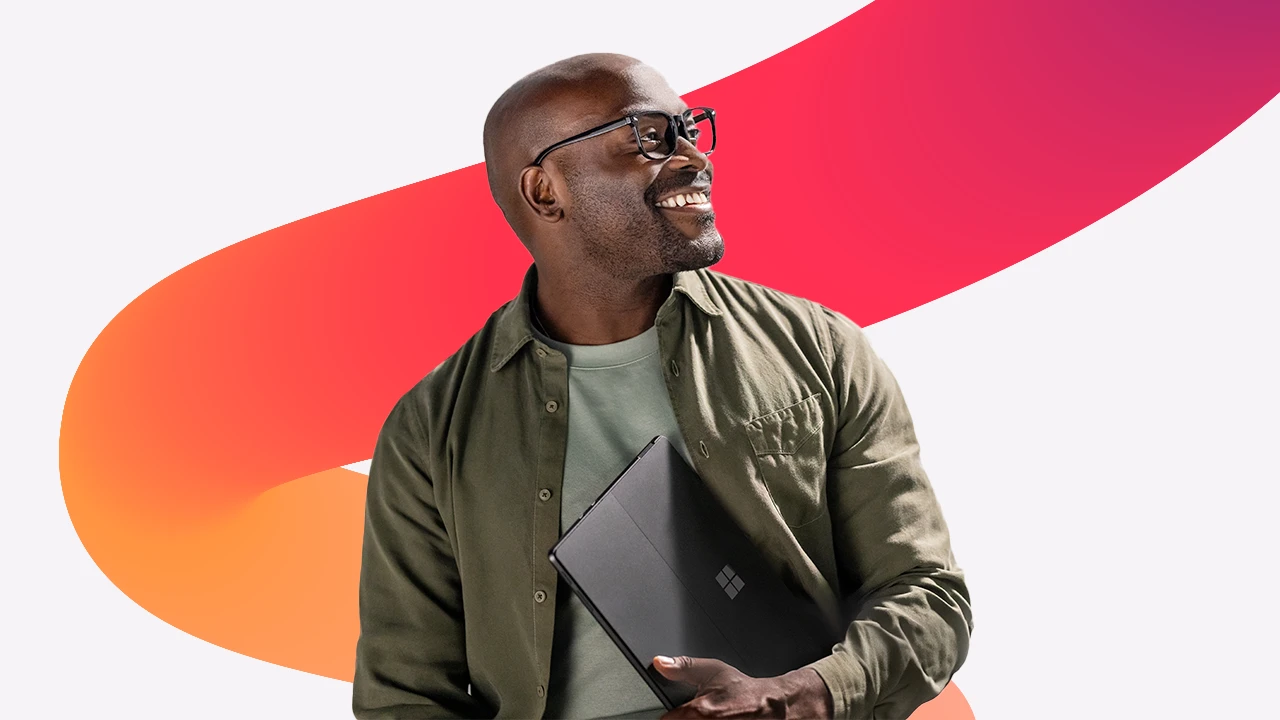 A man holding a laptop