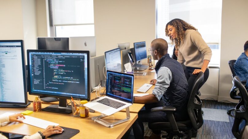 A group of people working on computers