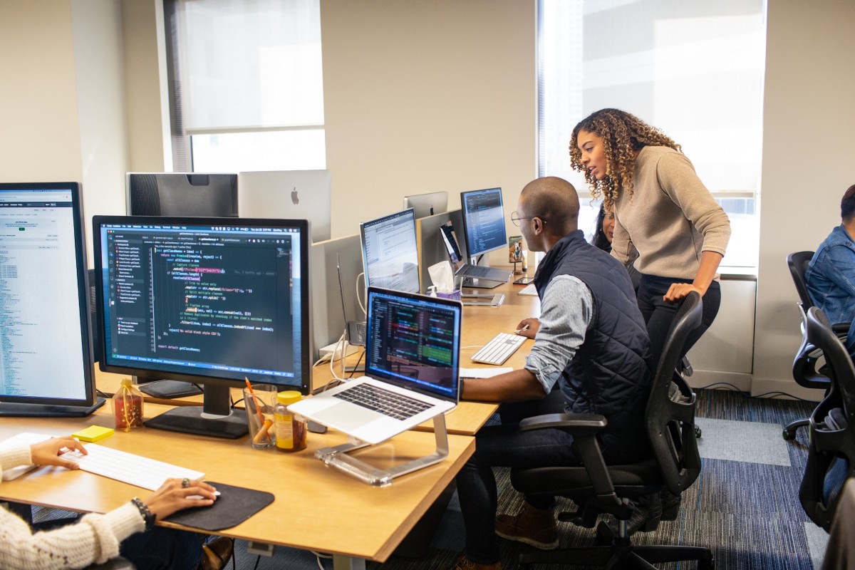 A group of people working on computers