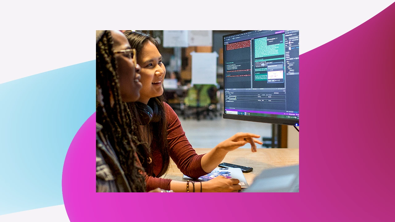 A group of women looking at a computer screen