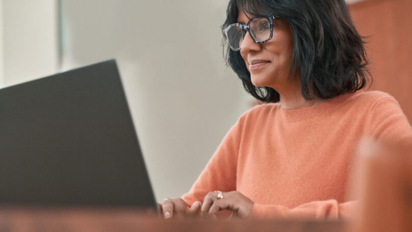 A woman working on a laptop