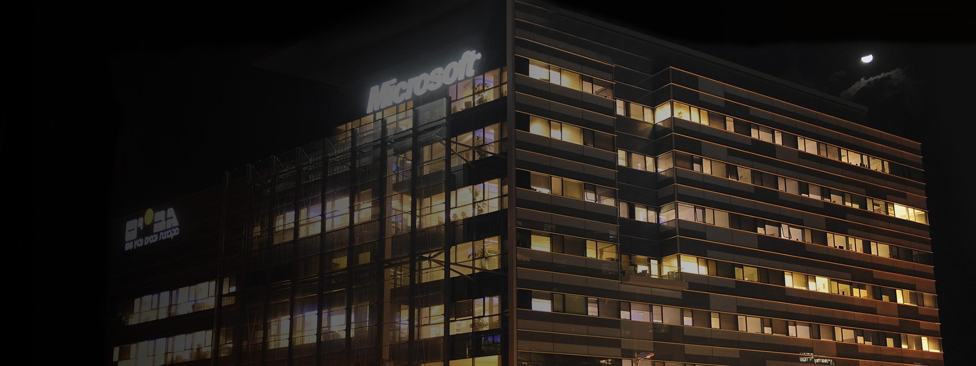 a tall building lit up at night