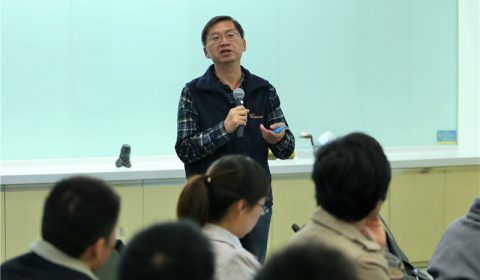 a group of people standing in a room