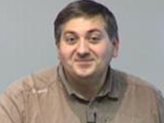 a man smiling for the camera