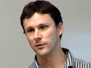 a man smiling for the camera