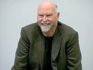 Craig Venter wearing a suit and tie