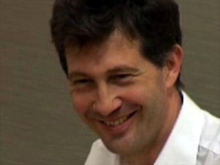 a man smiling for the camera