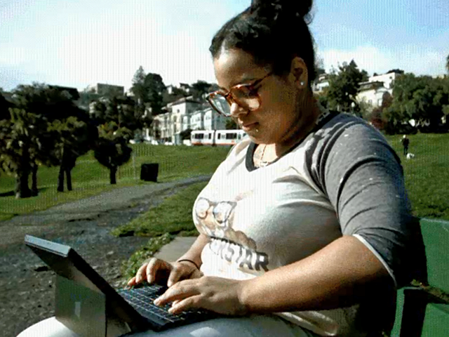 a man sitting at a picnic table