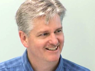 a man smiling for the camera