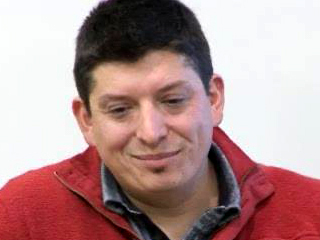 a man smiling for the camera