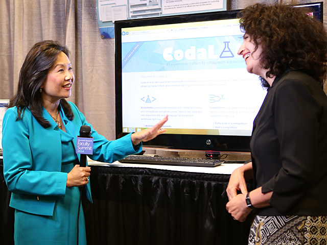 a person standing in front of a screen