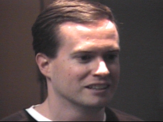 a person who is smiling and looking at the camera