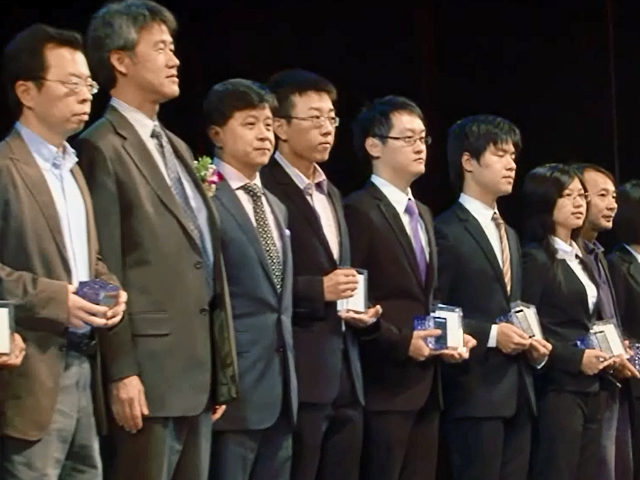 a group of people posing for the camera