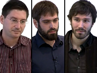 a man standing in front of a group of people posing for the camera