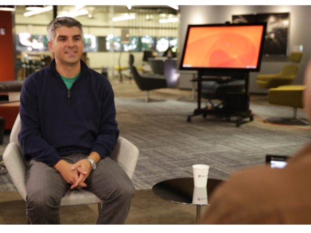 Hrvoje Benko sitting on a table