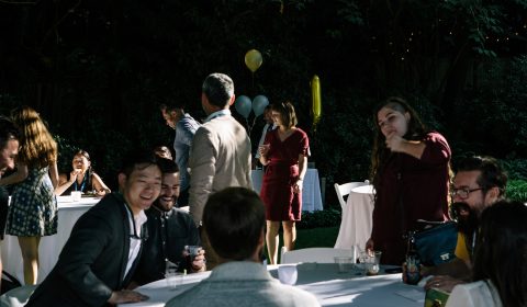 a group of people standing in front of a crowd