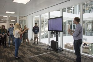 a group of people standing in a room