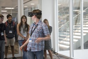 a group of people standing in front of a window