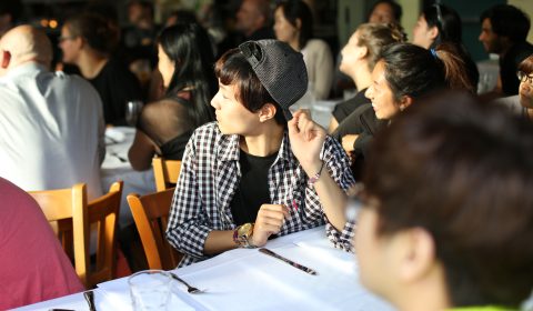 a group of people sitting at a table