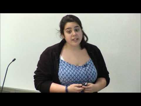 a woman sitting posing for the camera