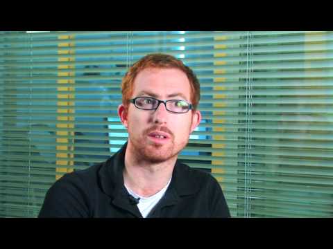 a man standing in front of a window