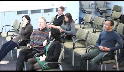 a group of people sitting in chairs