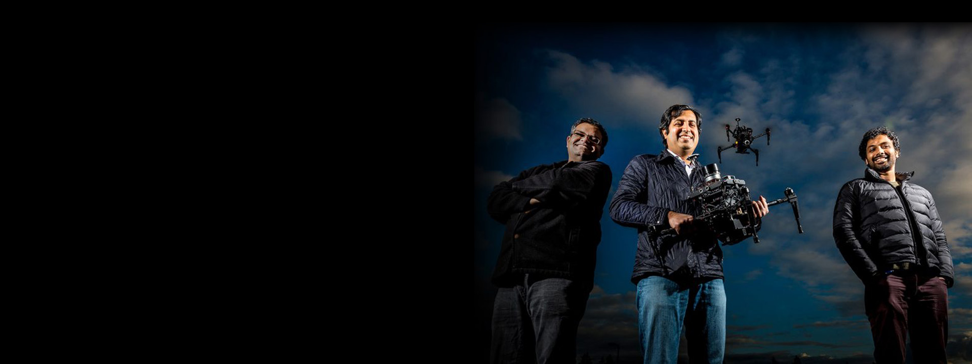 aerial informatics robotics - AirSim - three men posing with a drone
