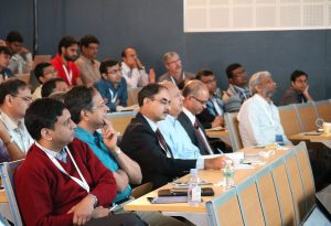 a group of people sitting at a desk