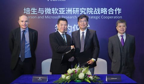 John Fallon, Hsiao-Wuen Hon standing next to a person in a suit and tie