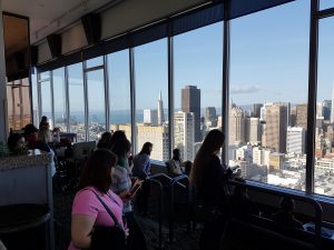 a group of people standing in front of a building