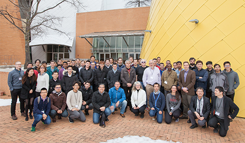 a group of people standing in front of a crowd