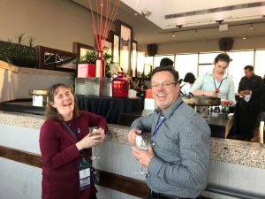 a group of people holding wine glasses