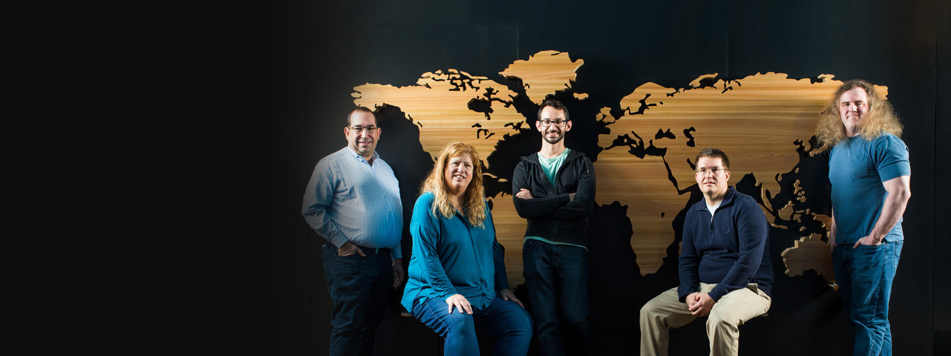 a group of people posing for the camera