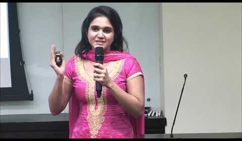 a woman standing in front of a mirror posing for the camera