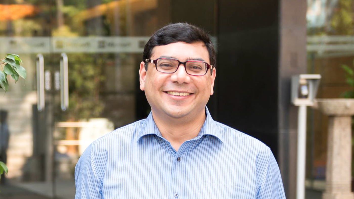 a man standing in front of a building
