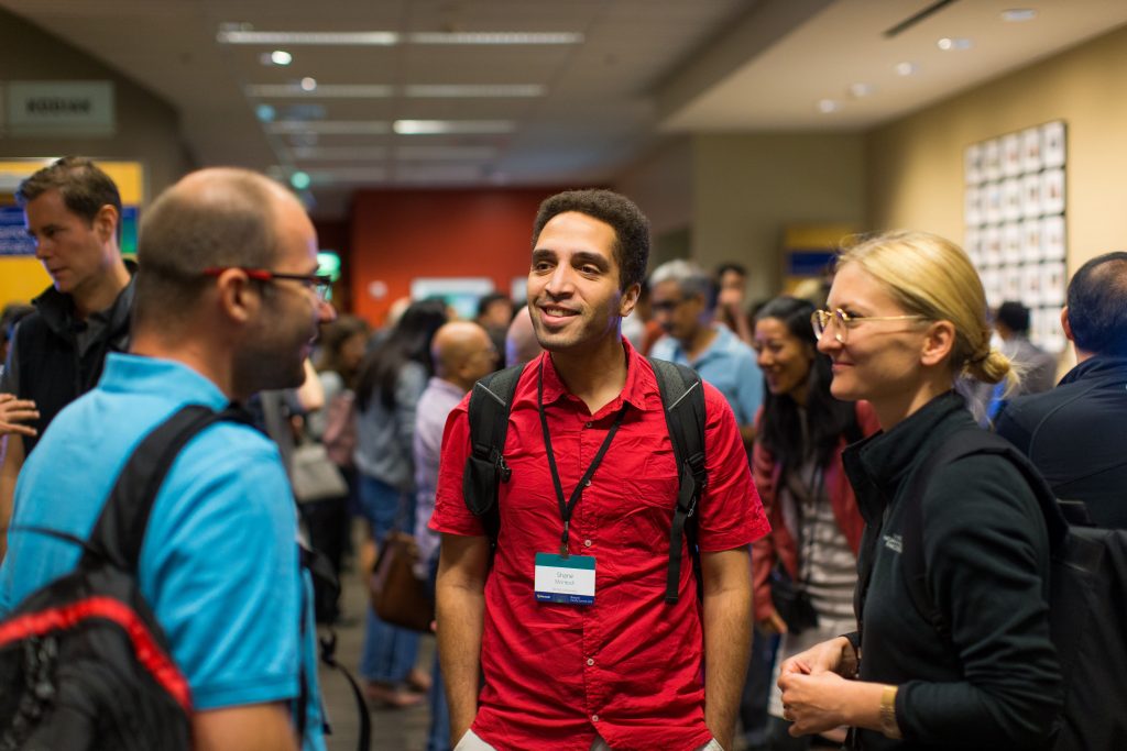 Attendees gather outside lecture halls of Faculty Summit 2018.