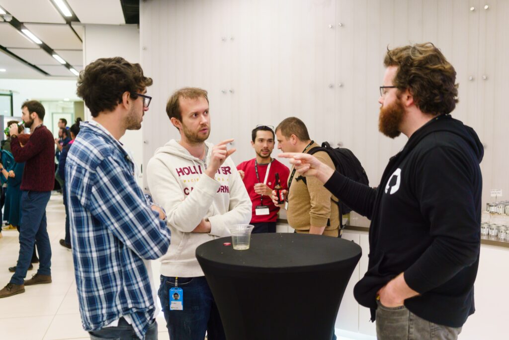 a group of people standing in a room