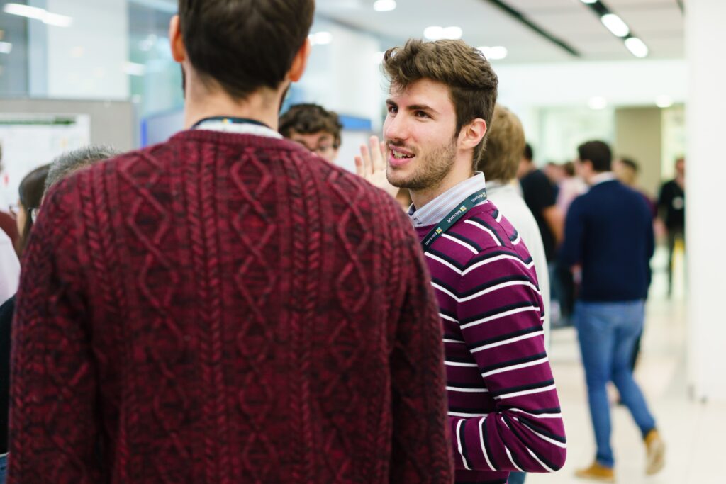 a group of people standing next to a person