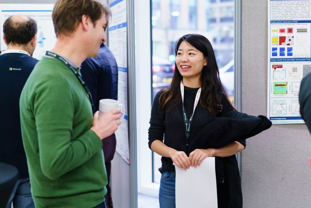 a man and a woman standing in front of a building