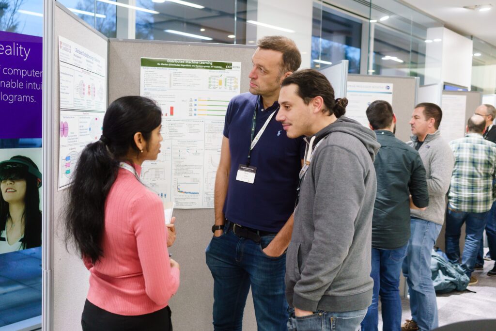 Thomas Karagiannis et al. standing in a room