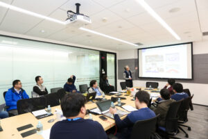 a group of people sitting at a desk